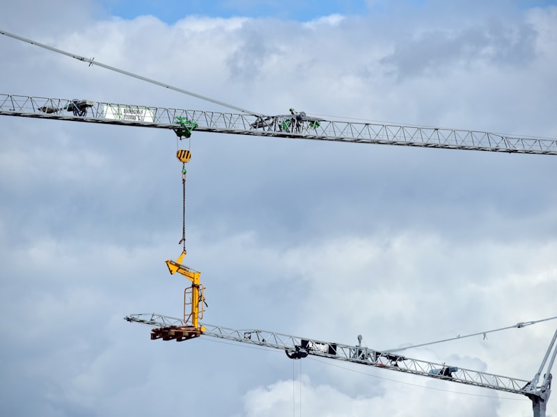Industrial crane lifting heavy equipment